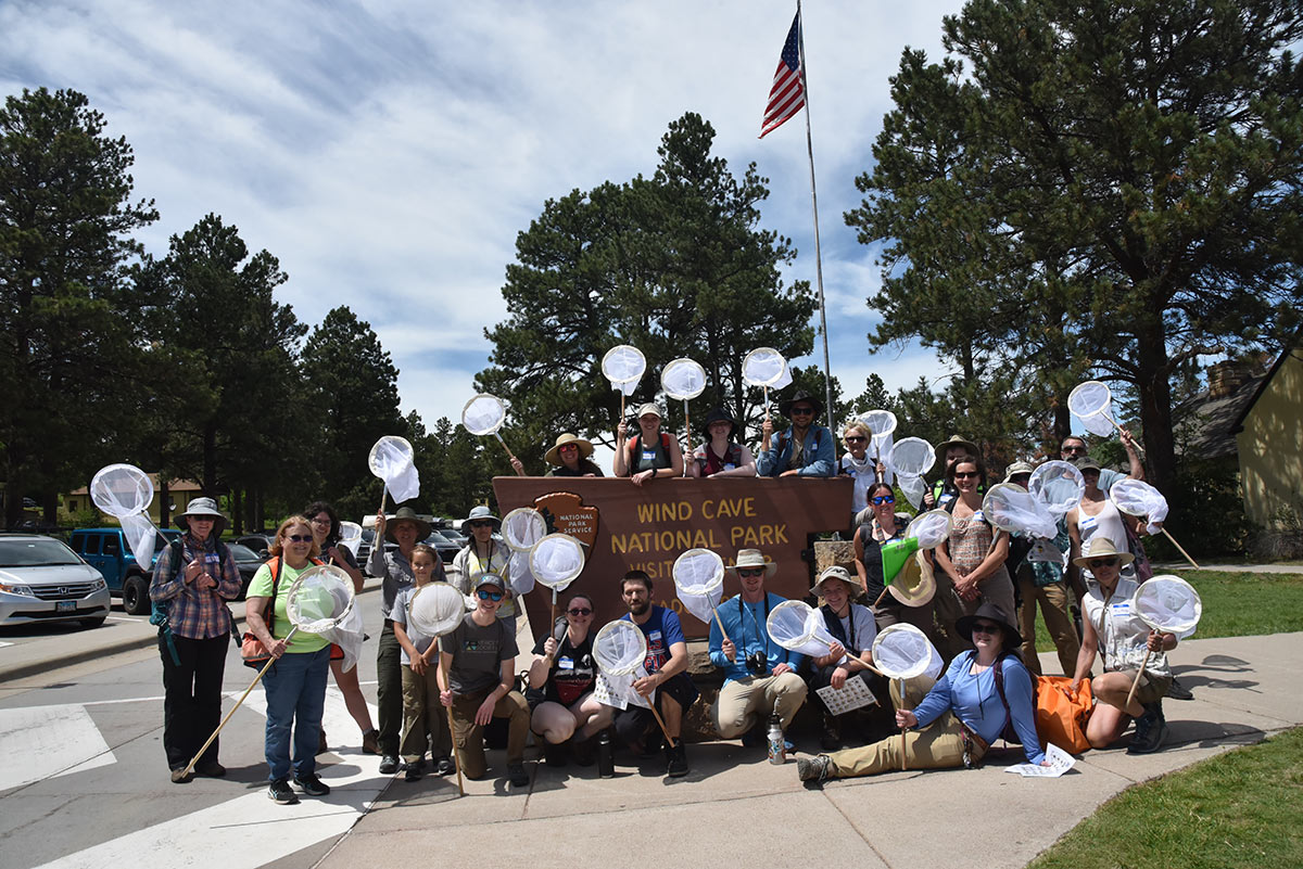Group of people posing with bee nets
