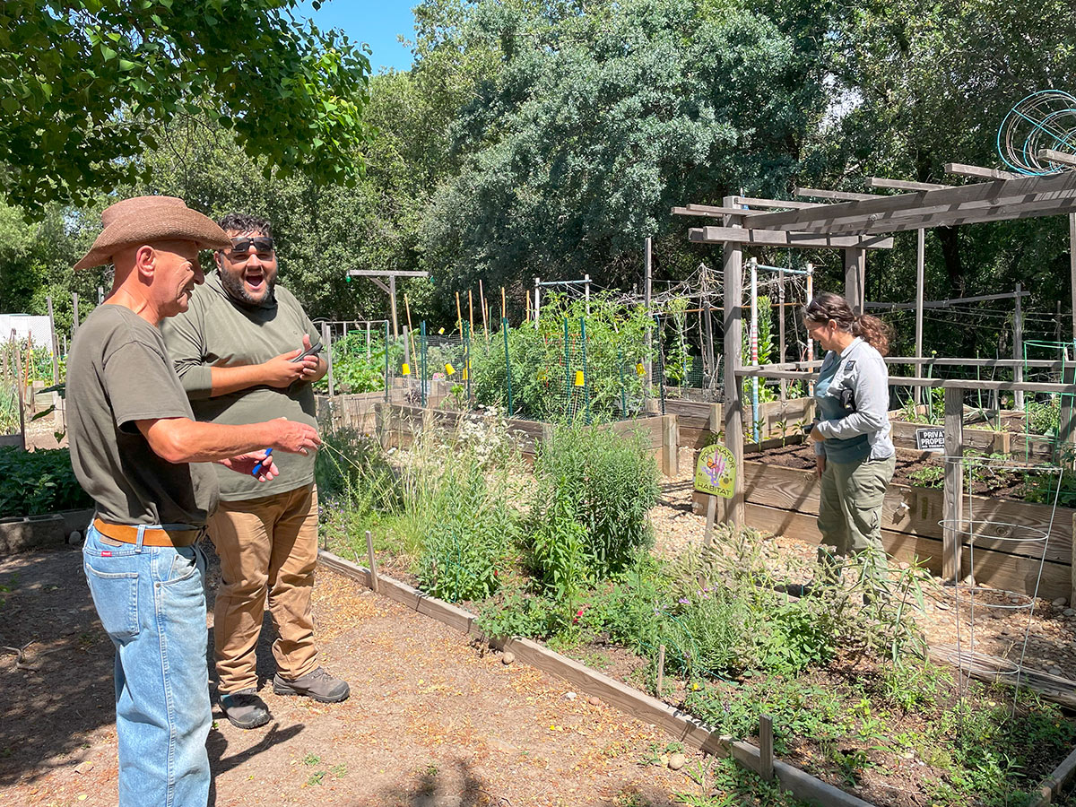 Xerces staff and partners laughing in a garden