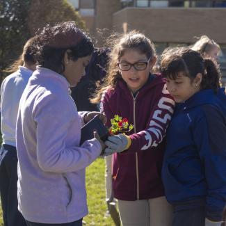 Young community scientists planting.