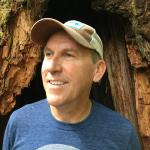 Scott Black in front of a tree