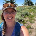 Amy Dolan outside surrounded by a natural landscape